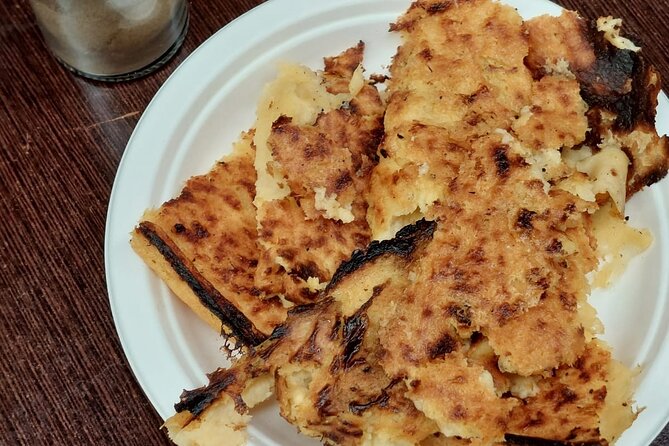 Nice Food Tour – A Full Meal on French Riviera by Do Eat Better - Stop 3 by Église Saint-François-de-Paule: socca and pissaladière